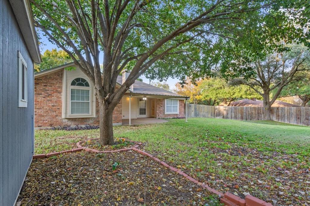 10700 Apache Drive Waco, TX 76712 - Photo 14 of 15 a large tree in front of a house