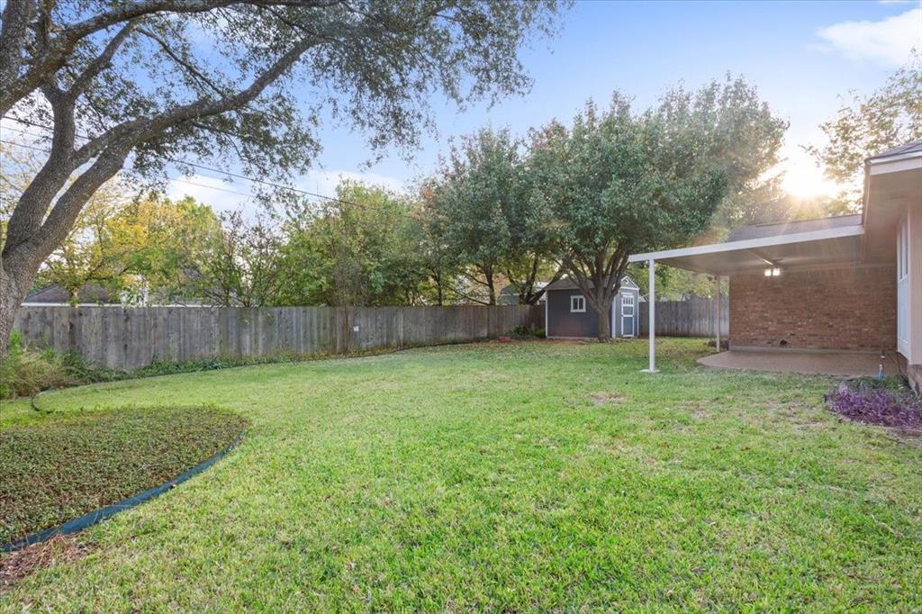 10700 Apache Drive Waco, TX 76712 - Photo 15 of 15 a backyard of a house with lots of green space