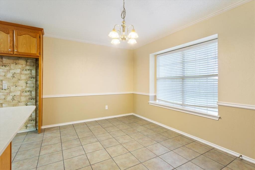 10700 Apache Drive Waco, TX 76712 - Photo 4 of 15 a view of an empty room with a window