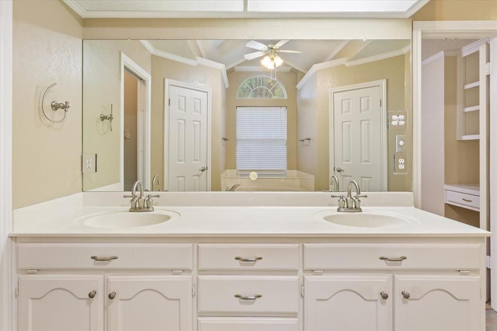 10700 Apache Drive Waco, TX 76712 - Photo 9 of 15 a bathroom with double vanity sinks and a mirror