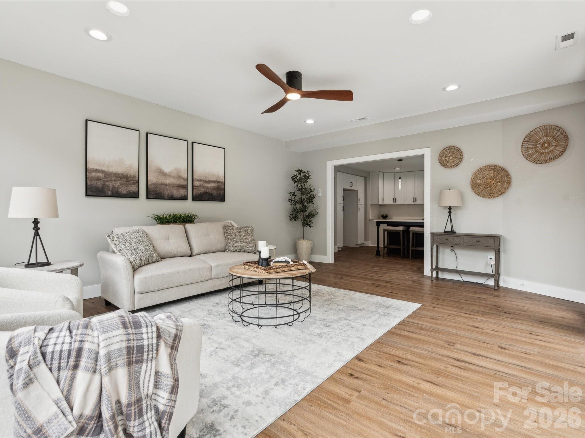 2000 Tyvola Road Charlotte, NC 28210 - Photo 19 of 32 a living room with furniture and wooden floor