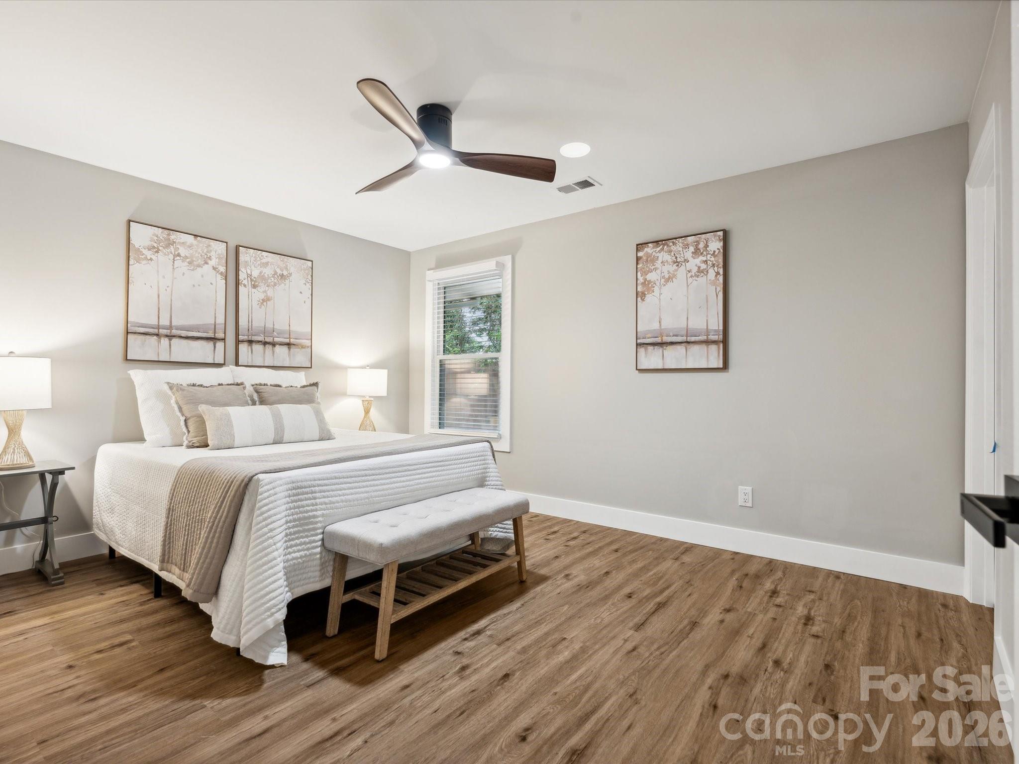 2000 Tyvola Road Charlotte, NC 28210 - Photo 23 of 32 a bed room with a bed and a window