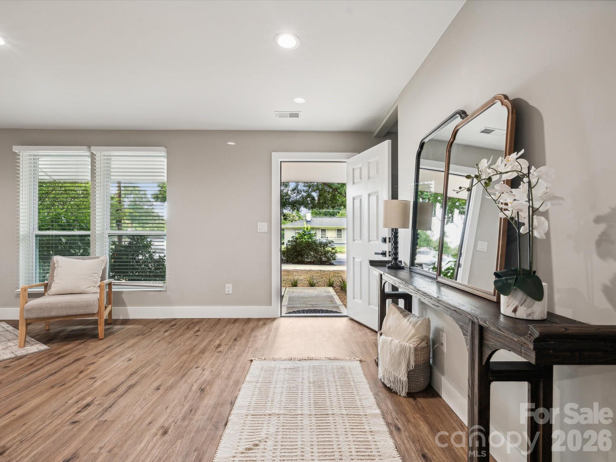 2000 Tyvola Road Charlotte, NC 28210 - Photo 3 of 32 a living room with furniture and a large window