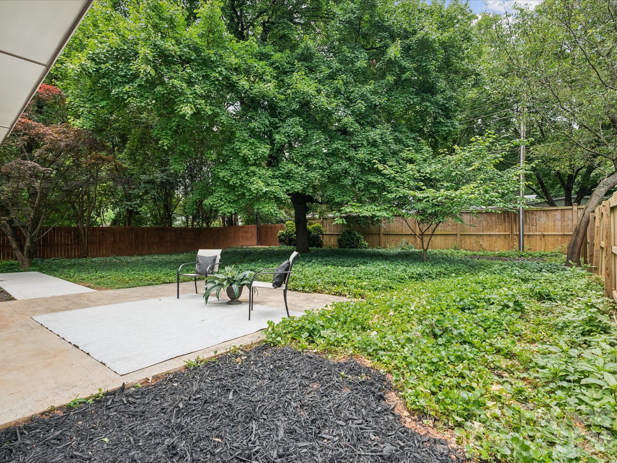 2000 Tyvola Road Charlotte, NC 28210 - Photo 31 of 32 a garden view with a seating space