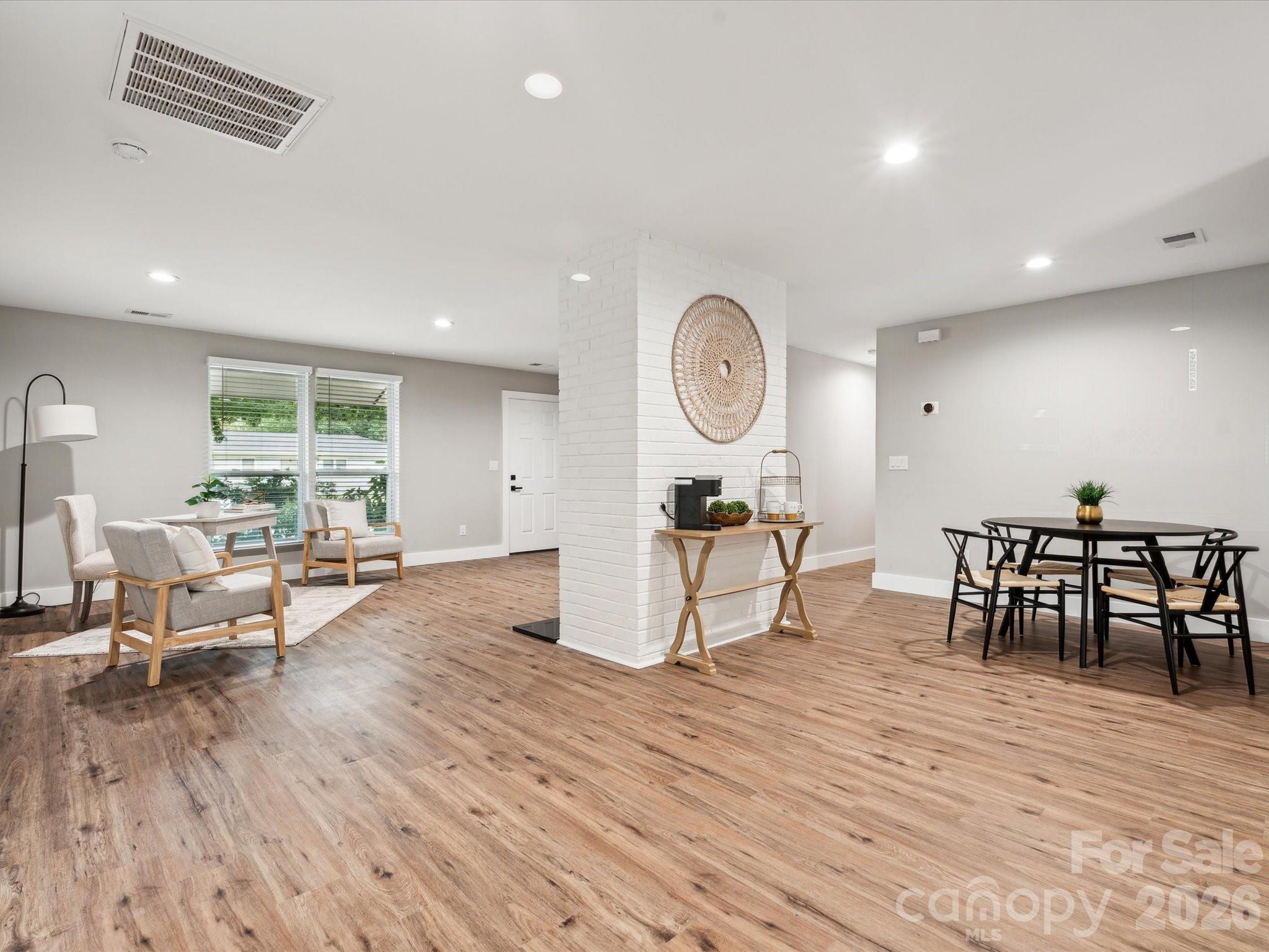 2000 Tyvola Road Charlotte, NC 28210 - Photo 7 of 32 a living room with furniture and a large window