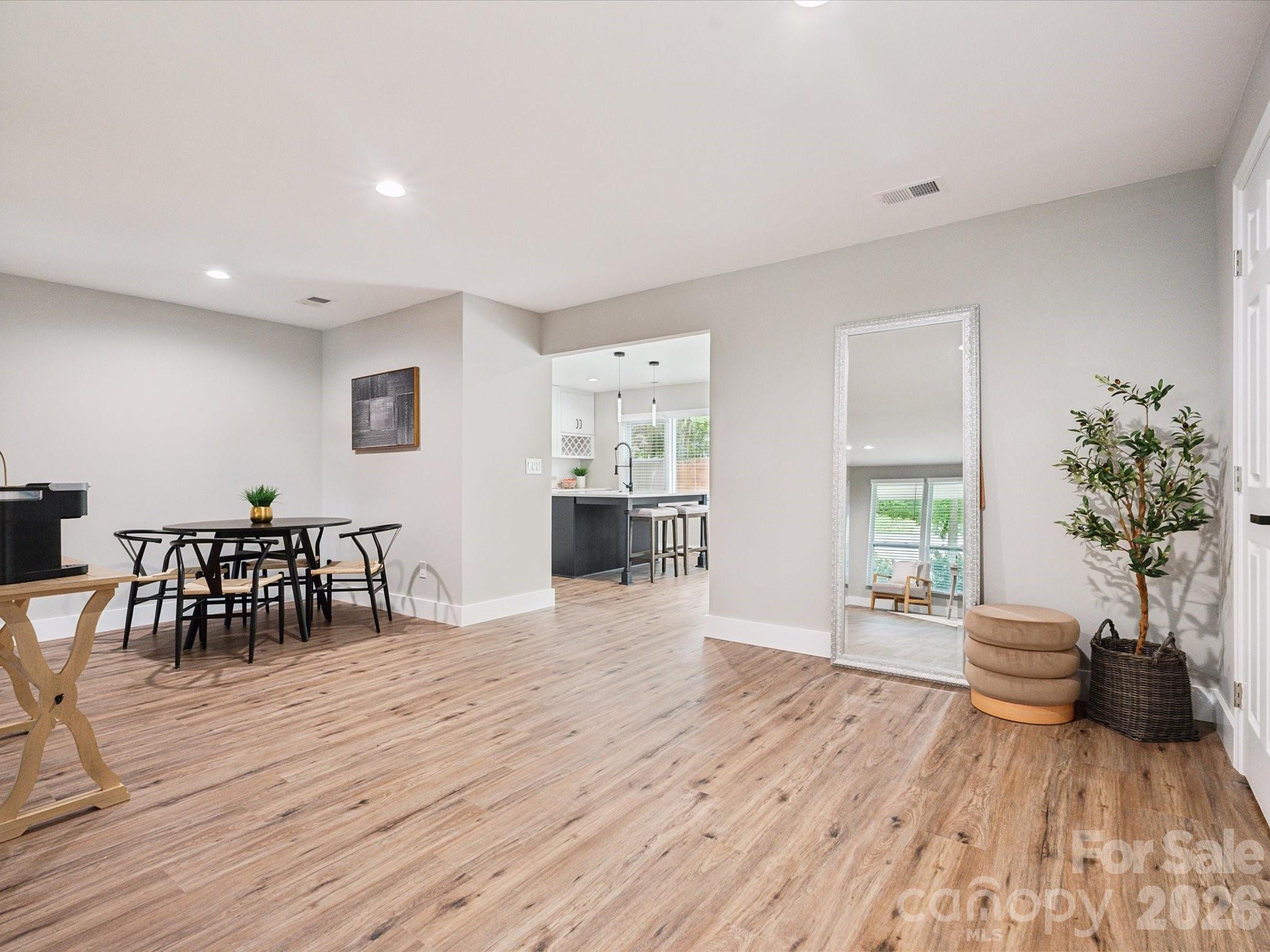 2000 Tyvola Road Charlotte, NC 28210 - Photo 10 of 32 a living room with furniture and a wooden floor