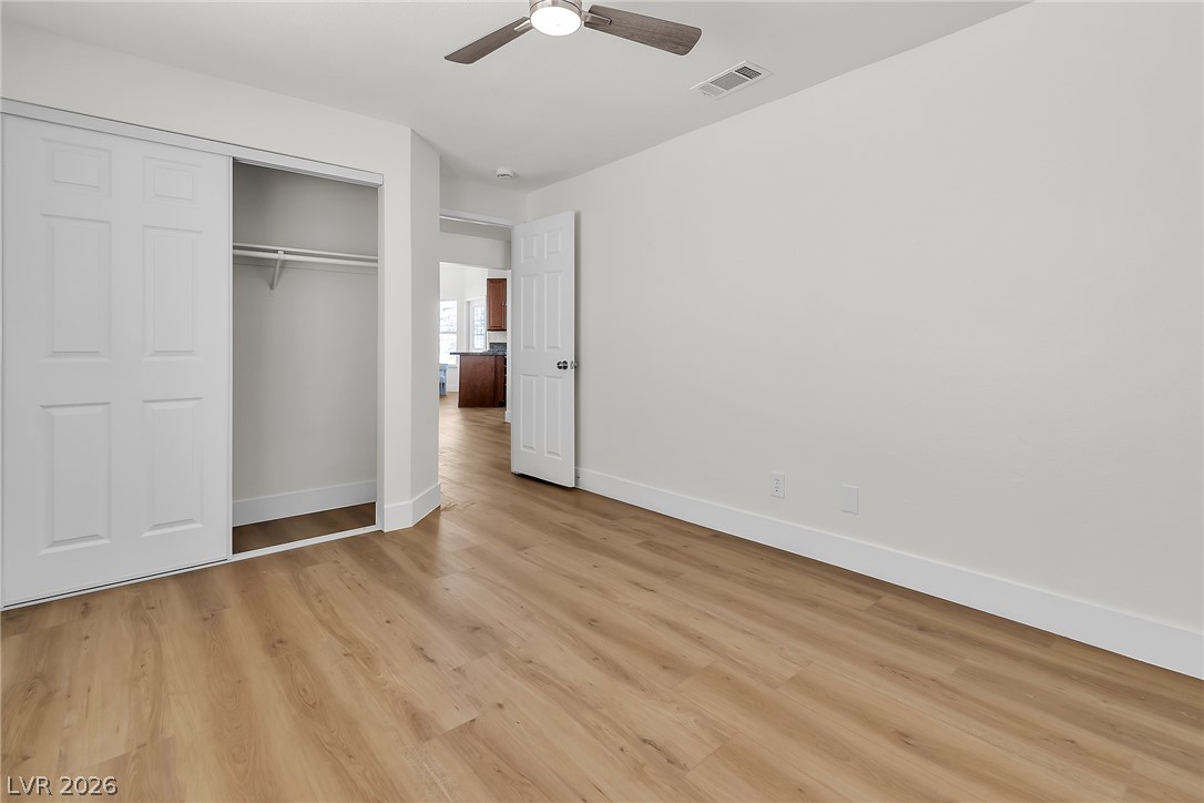 370 Rushing Creek Court Henderson, NV 89014 - Photo 23 of 32 Smooth wood-style flooring runs through this versatile space complete with built-in closet storage.