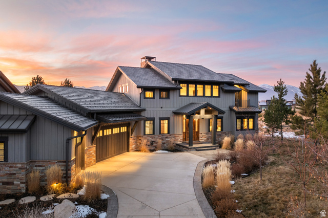 707 Chimney Rock Road, Unit 247 Heber City, UT 84032 - Photo 1 of 64 Modern inspired farmhouse featuring concrete driveway, stone siding, an attached garage, a chimney, and board and batten siding