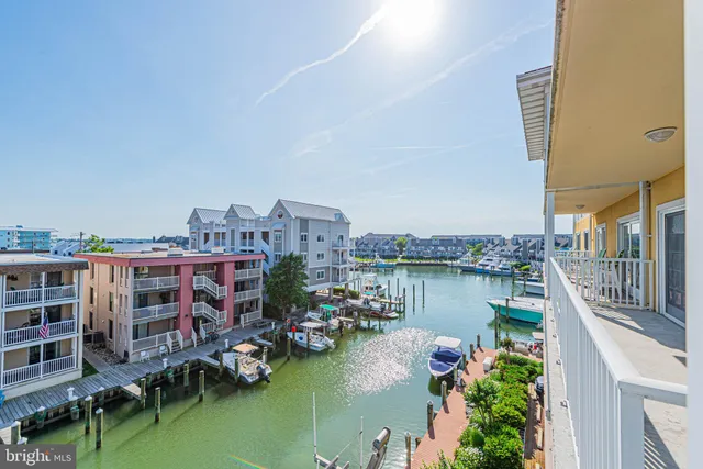 a view of a lake with tall buildings
