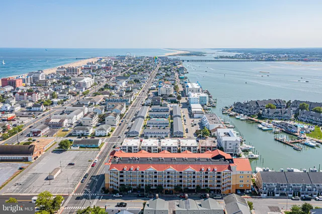 an aerial view of residential building and lake