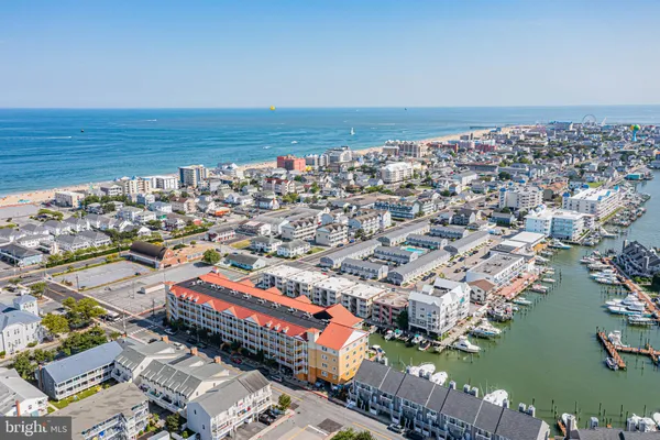 an aerial view of a city with ocean view