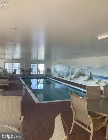 a kitchen with a table chairs stove and cabinets