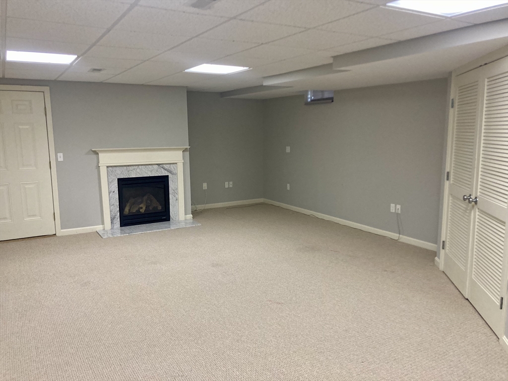 45 Turtle Brook Road, Unit 45 Canton, MA 02021 - Photo 11 of 14 an empty room with a fireplace