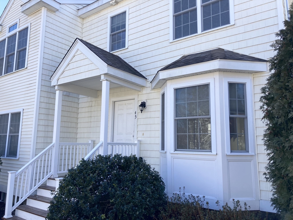 45 Turtle Brook Road, Unit 45 Canton, MA 02021 - Photo 14 of 14 a front view of a house with a garden