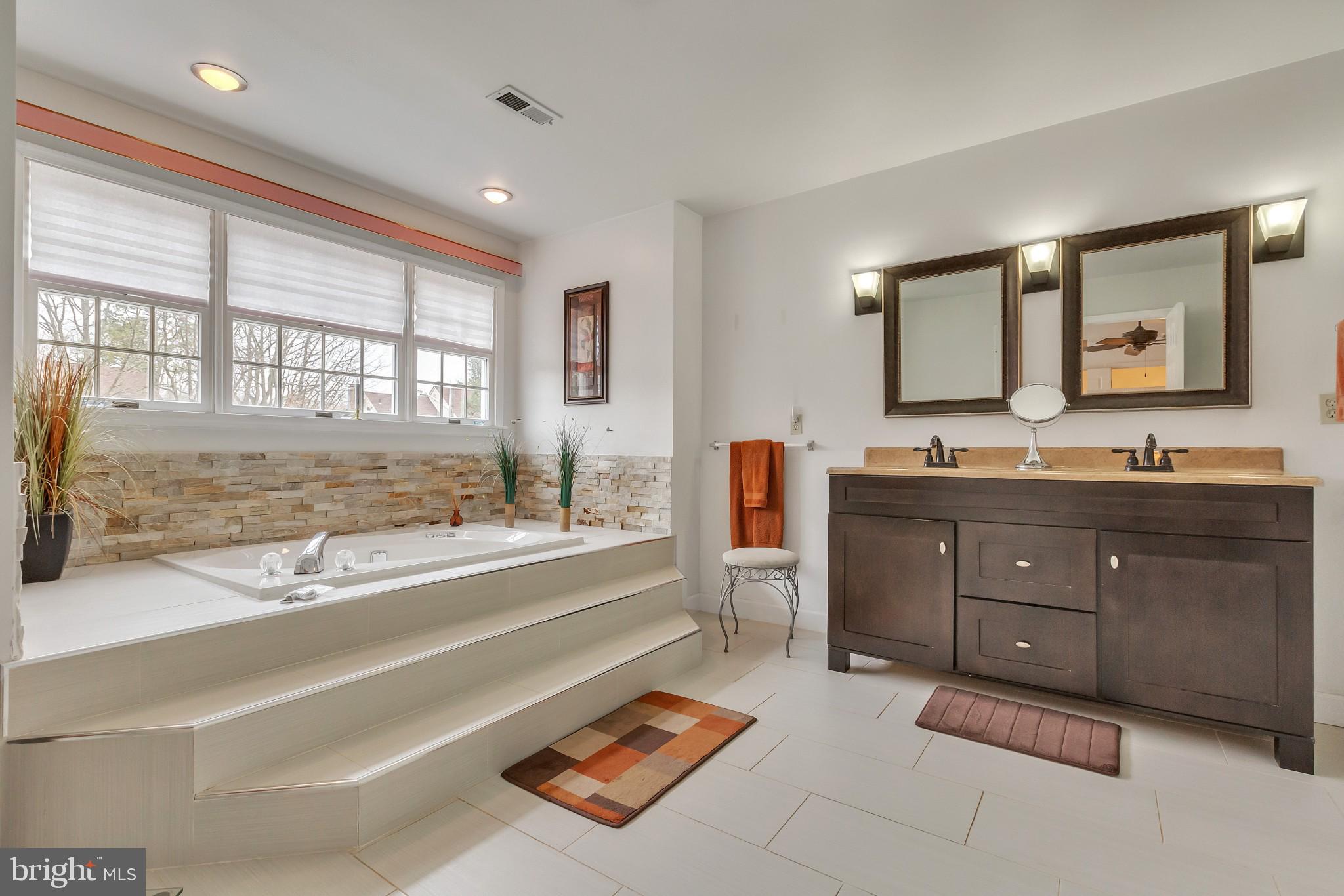 3 Bunning Drive Voorhees, NJ 08043 - Photo 18 of 31 a spacious bathroom with a tub sink and mirror