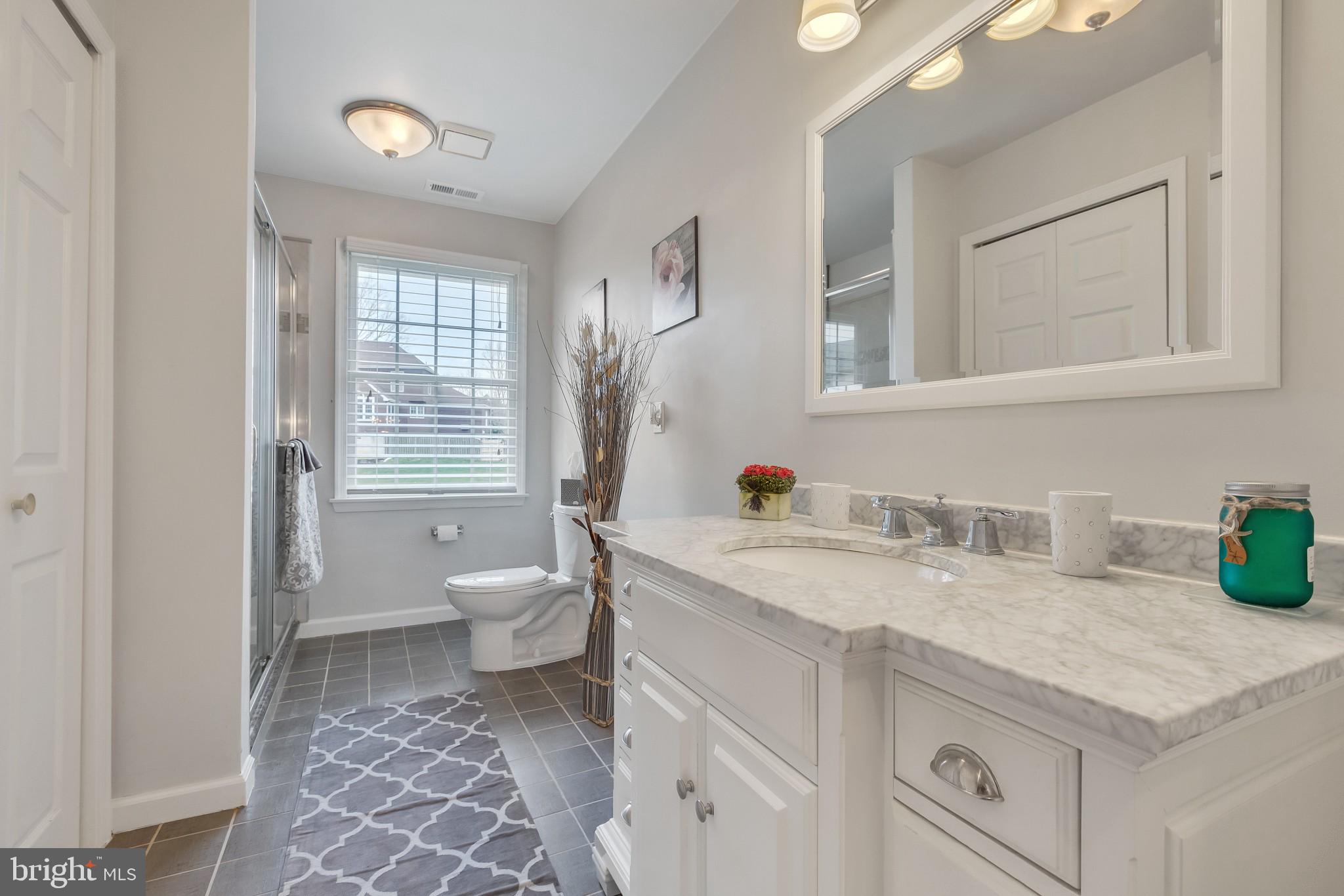 3 Bunning Drive Voorhees, NJ 08043 - Photo 24 of 31 a bathroom with a granite countertop sink toilet and a mirror
