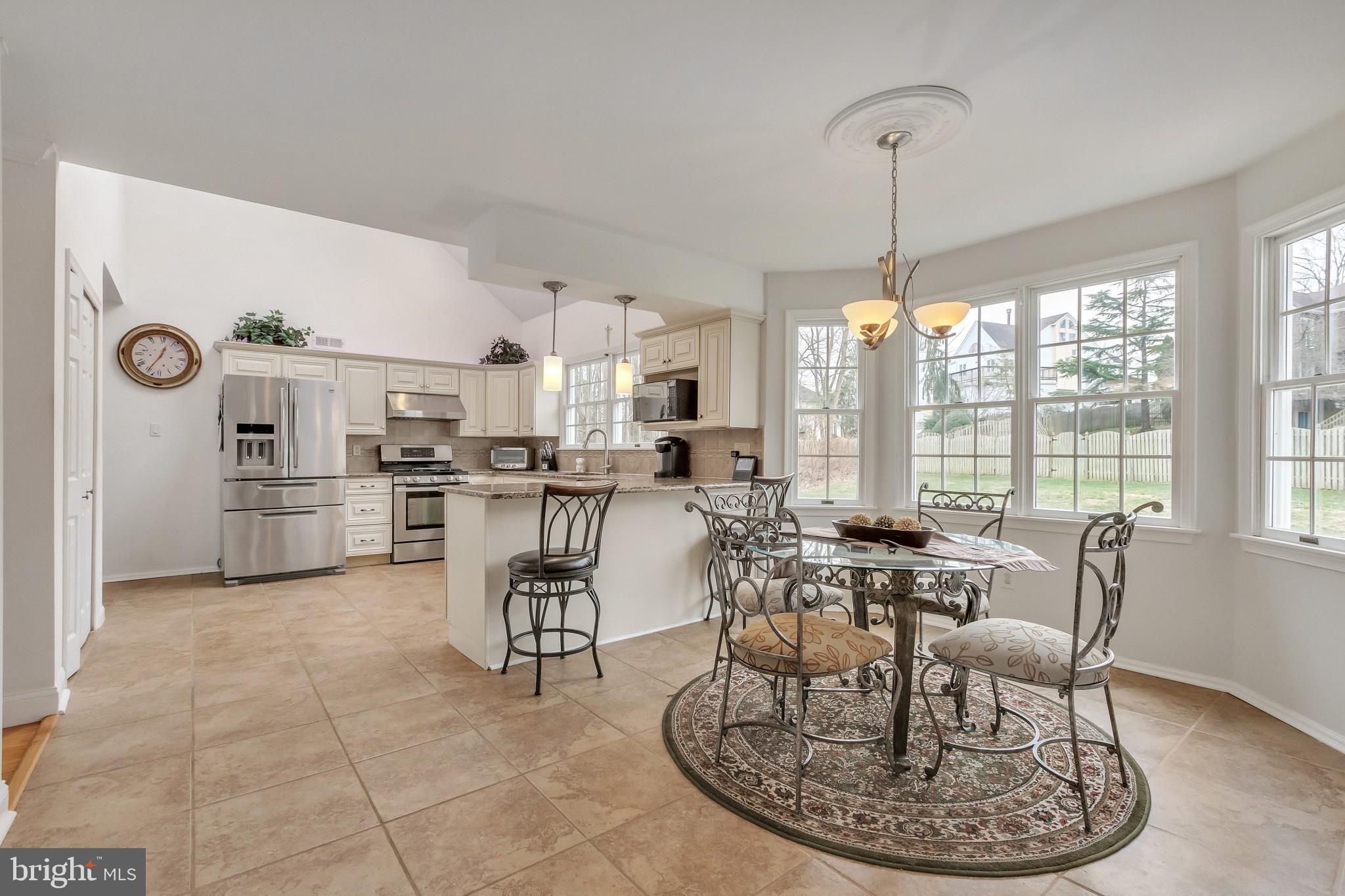 3 Bunning Drive Voorhees, NJ 08043 - Photo 6 of 31 a room with stainless steel appliances a dining table chairs and view of living room