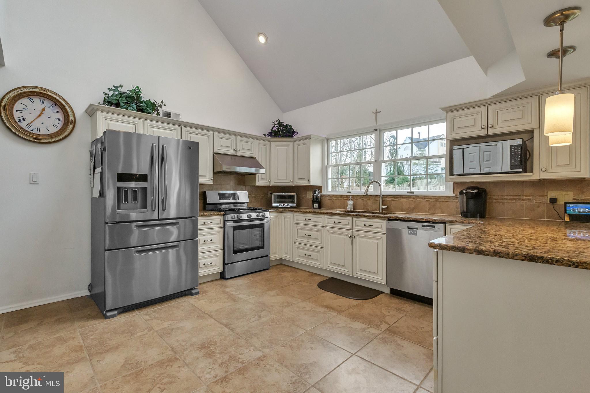 3 Bunning Drive Voorhees, NJ 08043 - Photo 7 of 31 a kitchen with granite countertop stainless steel appliances and a window