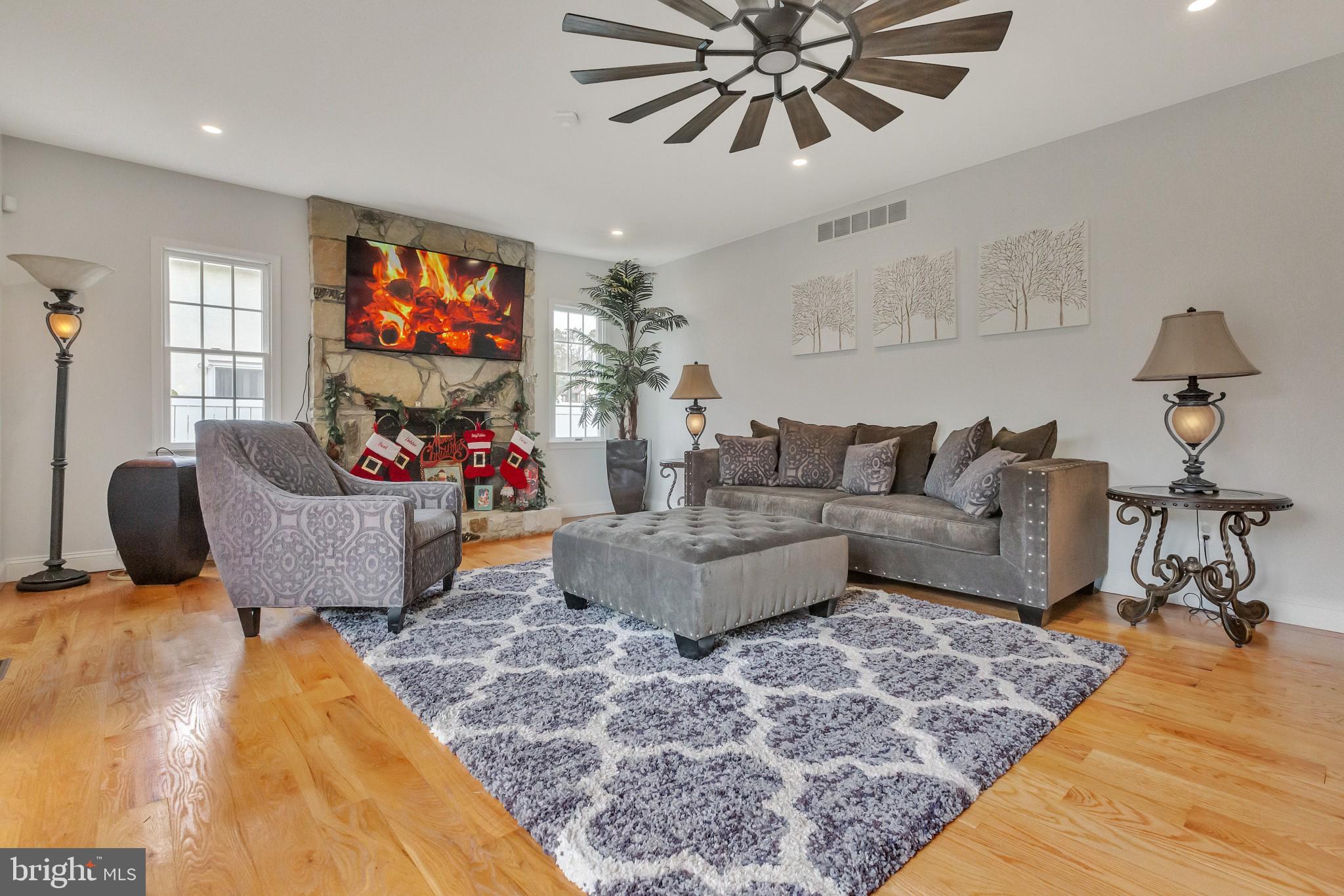 3 Bunning Drive Voorhees, NJ 08043 - Photo 9 of 31 a living room with furniture and a flat screen tv