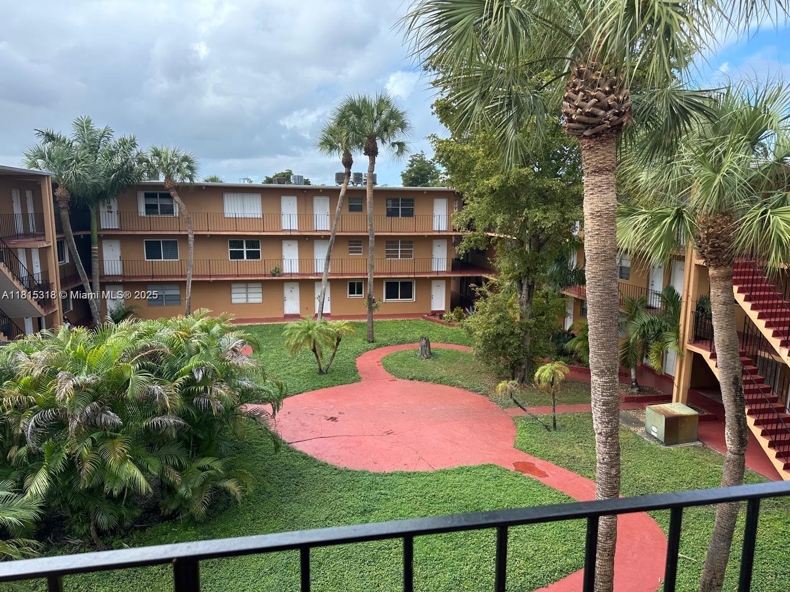 a view of a garden with a house