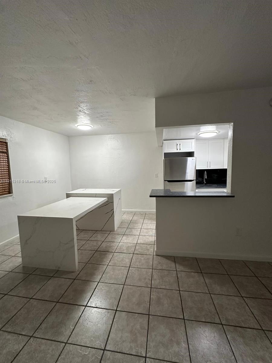 1230 West 54th Street, Unit 325A Hialeah, FL 33012 - Photo 3 of 10 a kitchen with a sink and cabinets