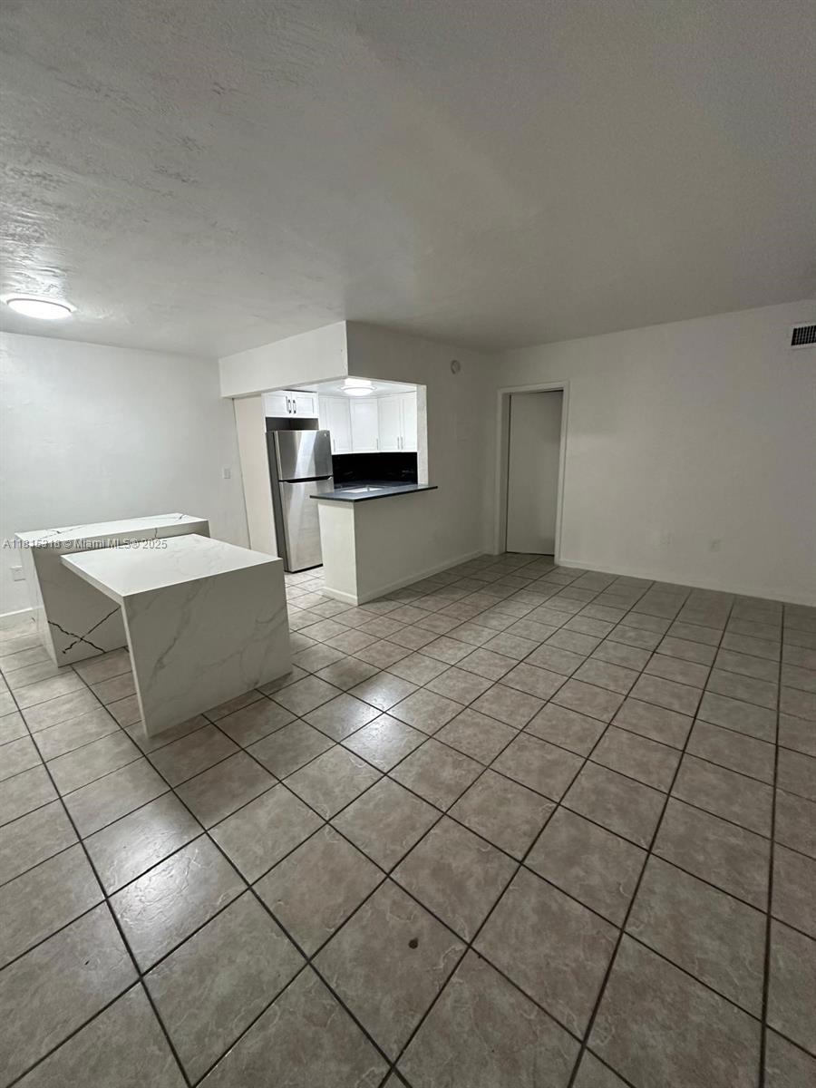1230 West 54th Street, Unit 325A Hialeah, FL 33012 - Photo 4 of 10 a view of a livingroom and window