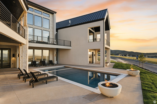 923 North Emery Lane Elk Ridge, UT 84651 - Photo 86 of 101 Contemporary exterior with a rectangular swimming pool and expansive concrete patio