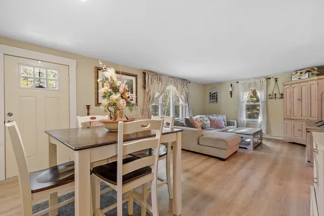 a bathroom with a toilet and a shower curtain