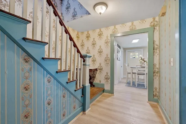 a bathroom with a sink toilet and a mirror