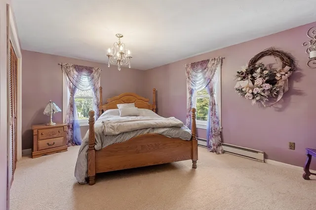 a bedroom with furniture and a window