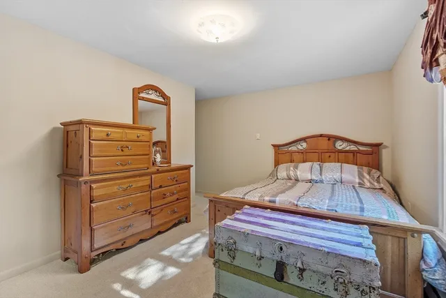 a bedroom with a bed and a table in it