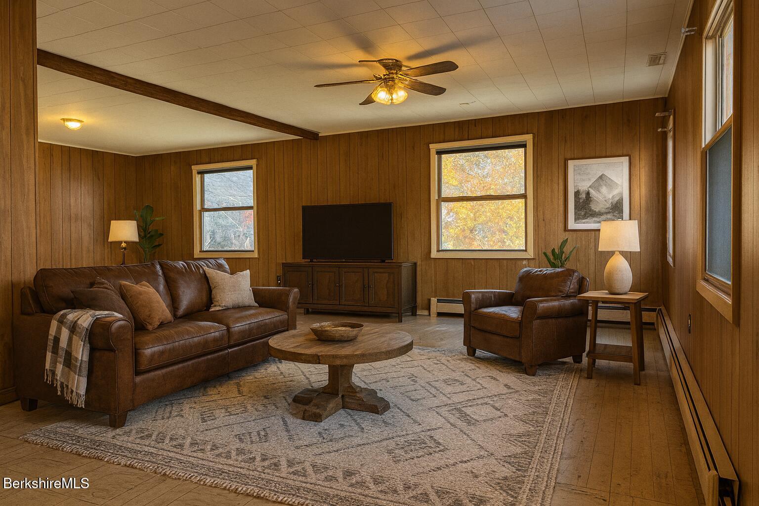 153 East Main Street Sheffield, MA 01222 - Photo 13 of 29 a living room with furniture a flat screen tv and a window