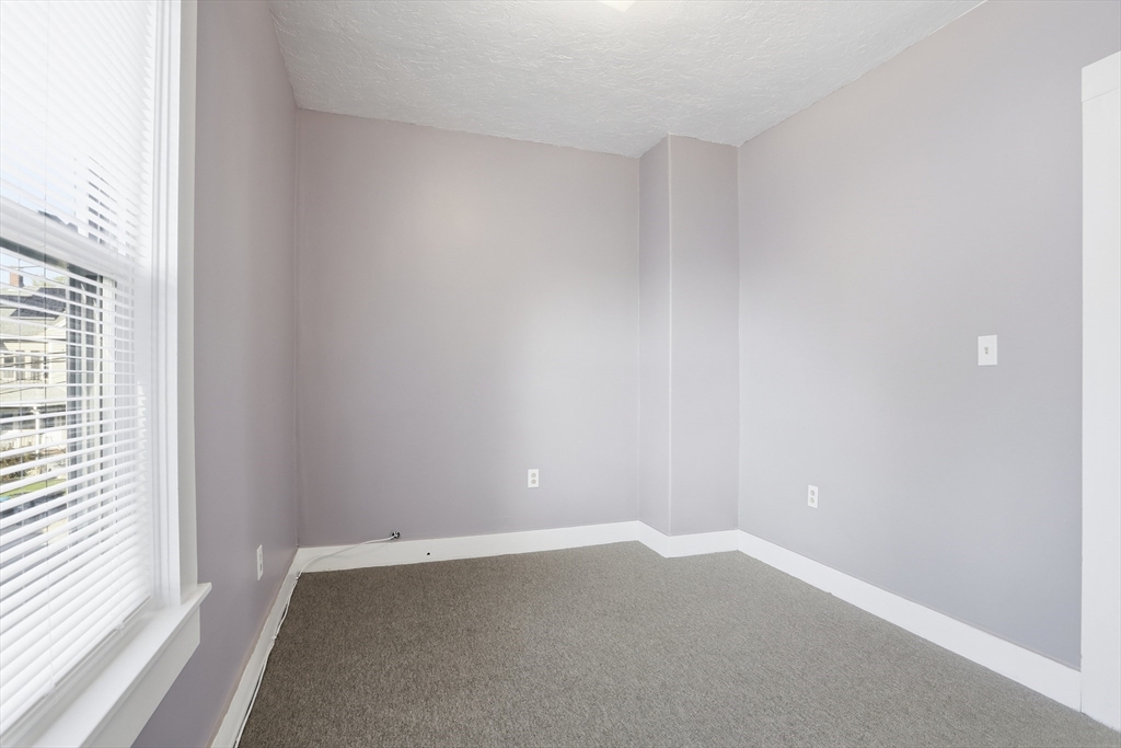 12 Whitcomb Street Webster, MA 01570 - Photo 22 of 40 an empty room with a window