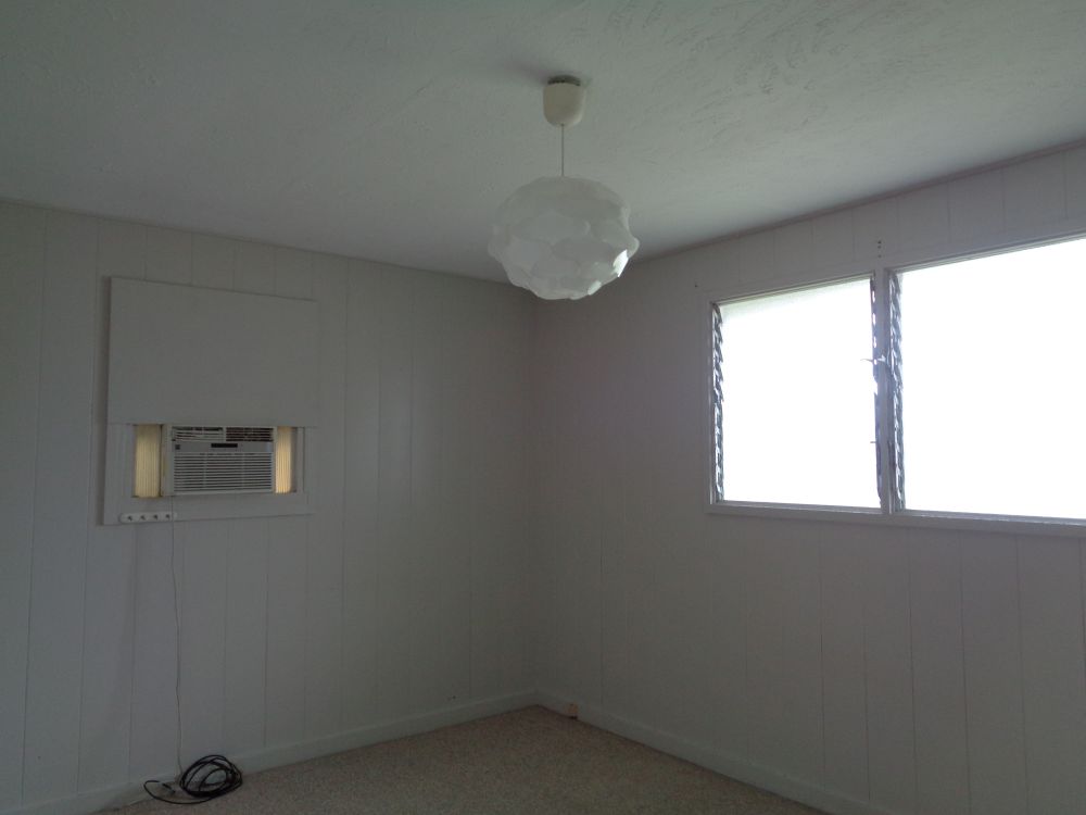 360 A Lama Street Hilo, HI 96720 - Photo 22 of 28 an empty room with a window