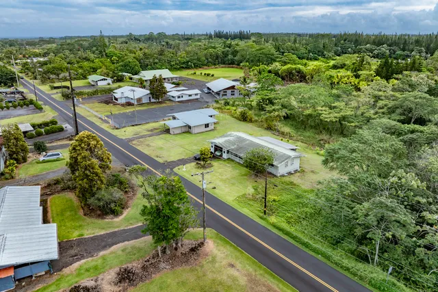 a view of a garden with an outdoor seating