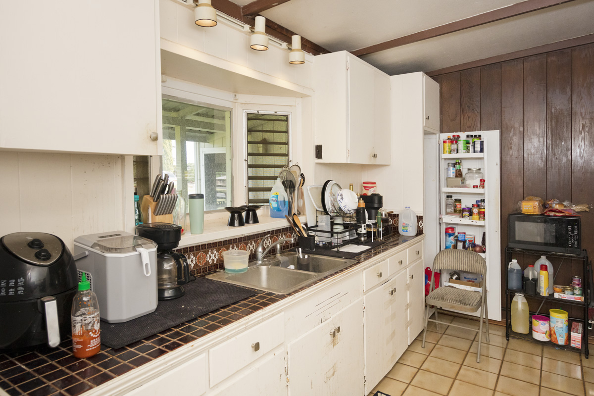 360 A Lama Street Hilo, HI 96720 - Photo 7 of 28 a kitchen with sink a stove and cabinets