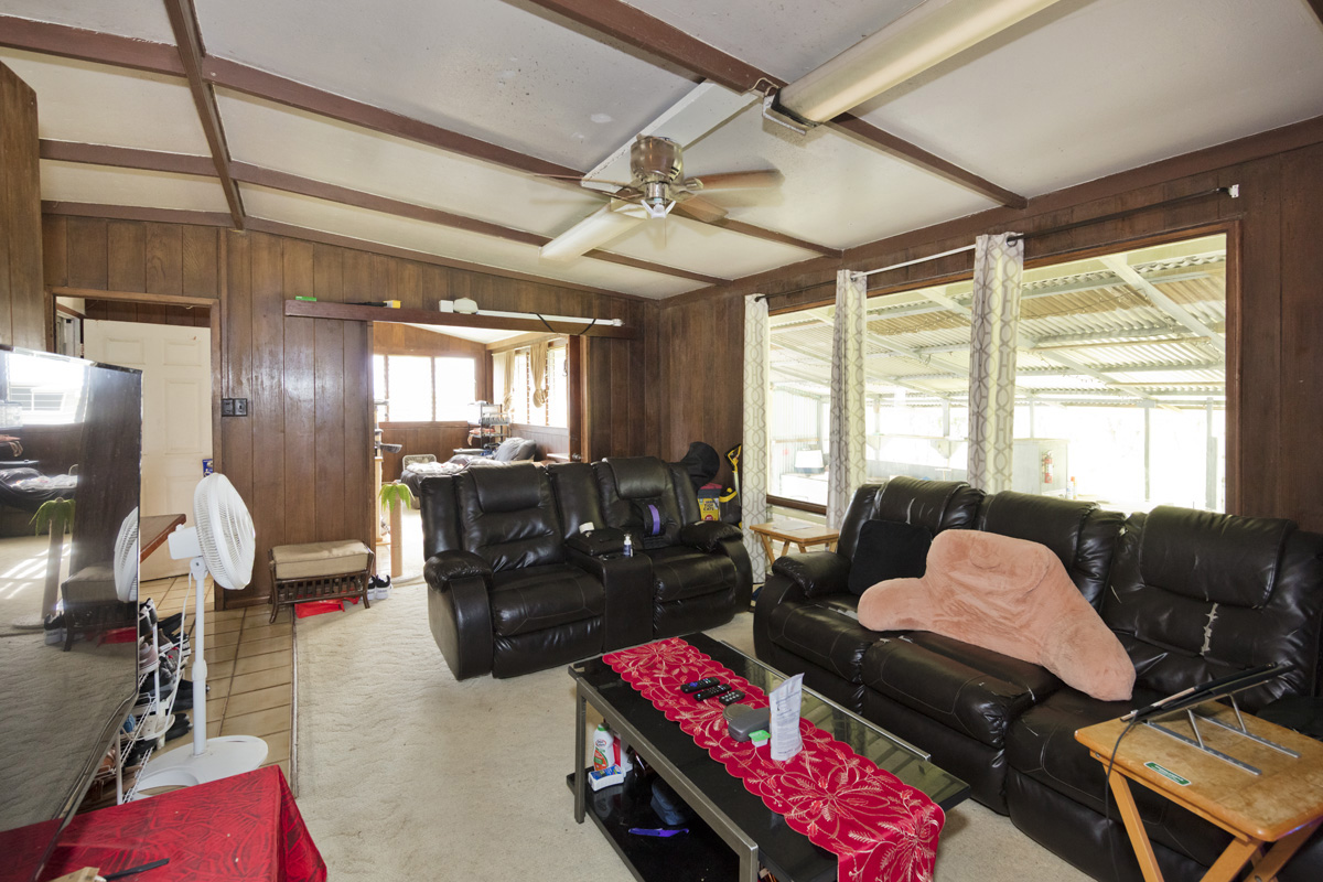 360 A Lama Street Hilo, HI 96720 - Photo 9 of 28 a bedroom with furniture and a window