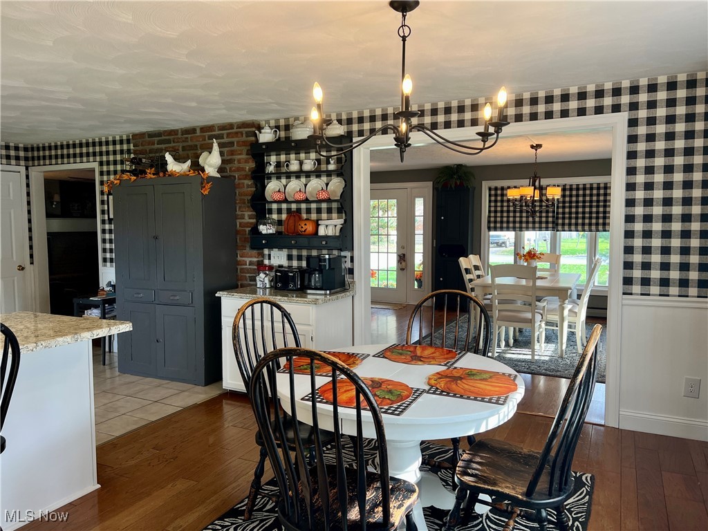 446 Annis Road Amherst, OH 44001 - Photo 7 of 39 Dining room with a notable chandelier, dark hardwood / wood-style floors