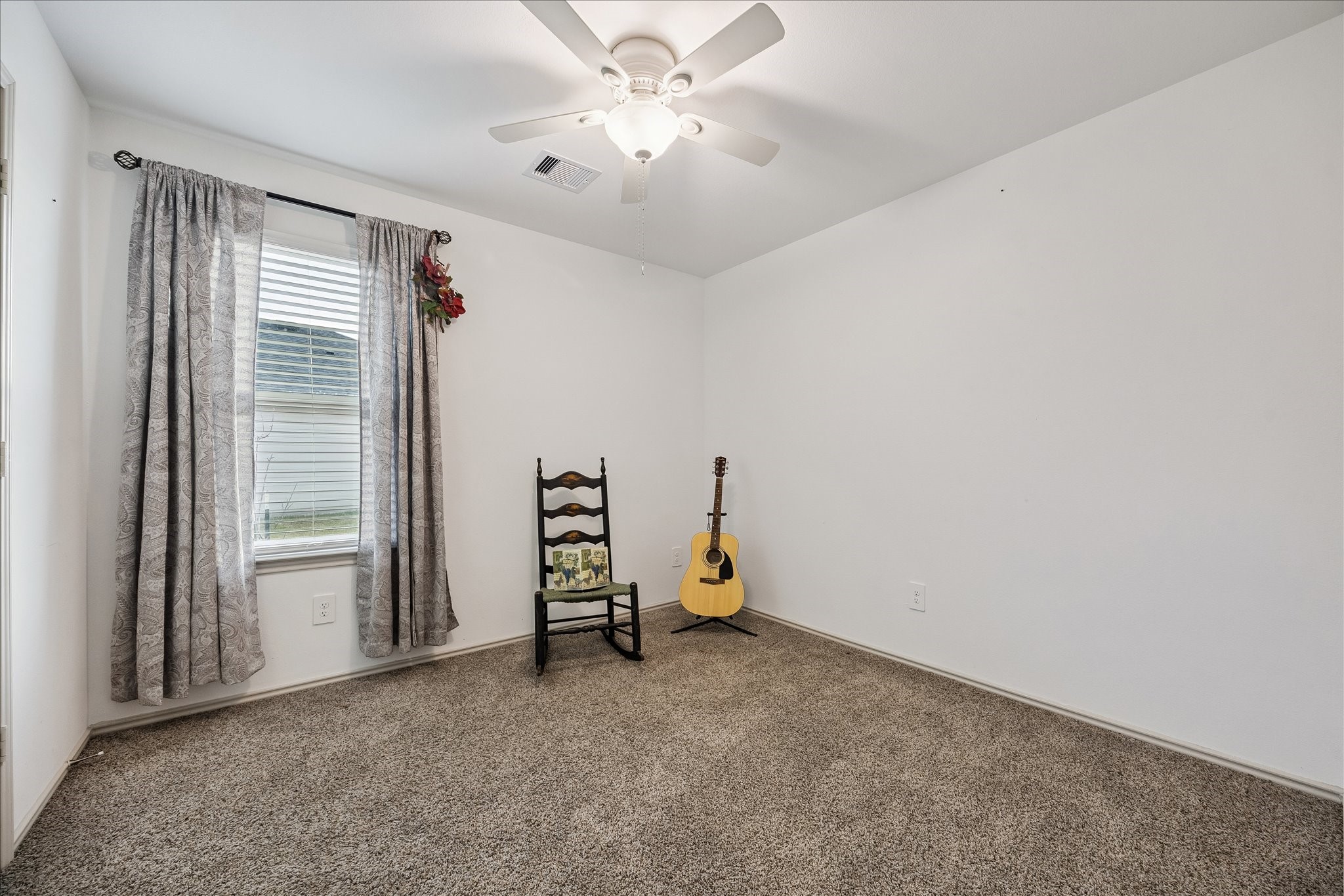 1237 Waterside Trace Sealy, TX 77474 - Photo 12 of 18 an empty room with windows and fan
