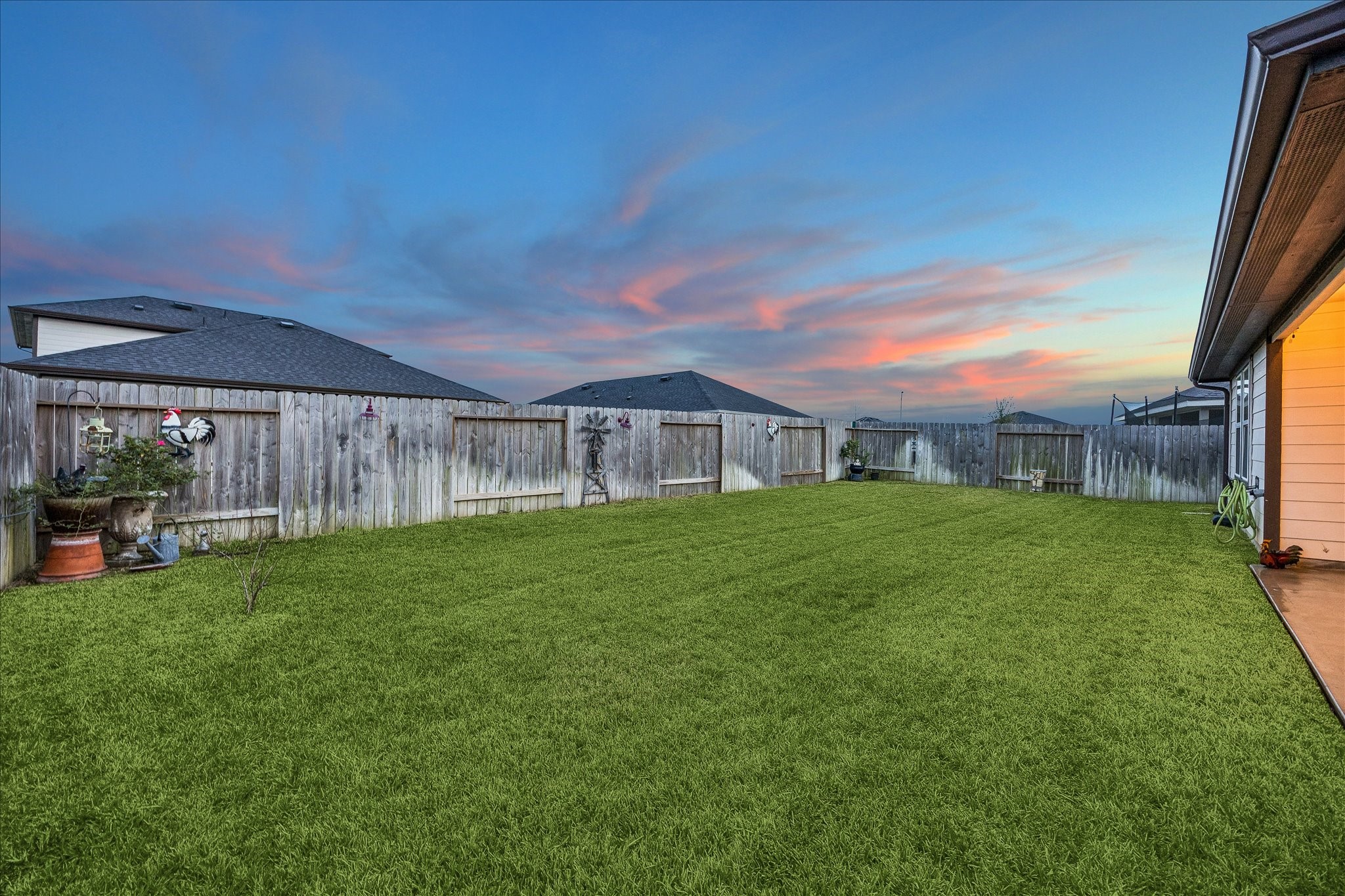 1237 Waterside Trace Sealy, TX 77474 - Photo 16 of 18 a view of a house with a yard porch and sitting area