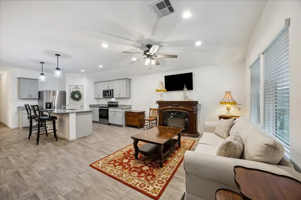 a living room with furniture and a fireplace