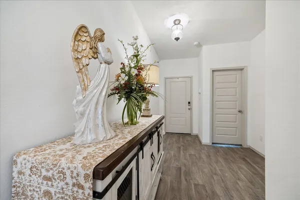 a view of a room with wooden floor and closet