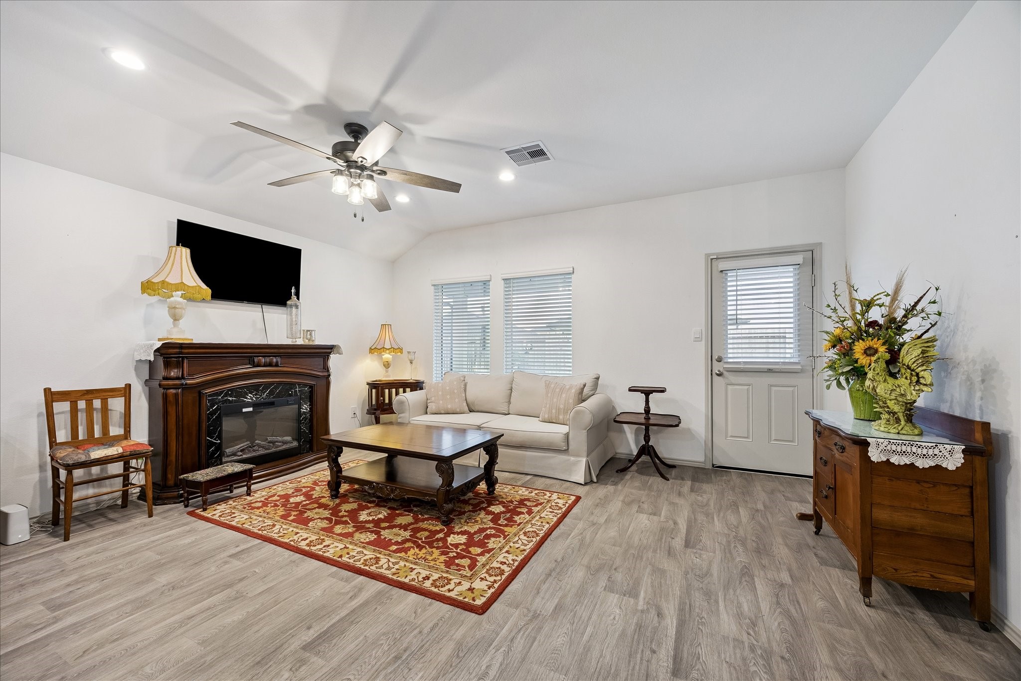 1237 Waterside Trace Sealy, TX 77474 - Photo 9 of 18 a living room with furniture a fireplace and a flat screen tv