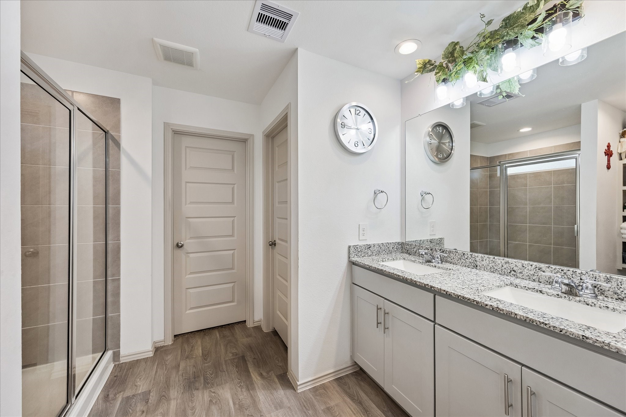 1237 Waterside Trace Sealy, TX 77474 - Photo 10 of 18 a spacious bathroom with a granite countertop sink and a mirror
