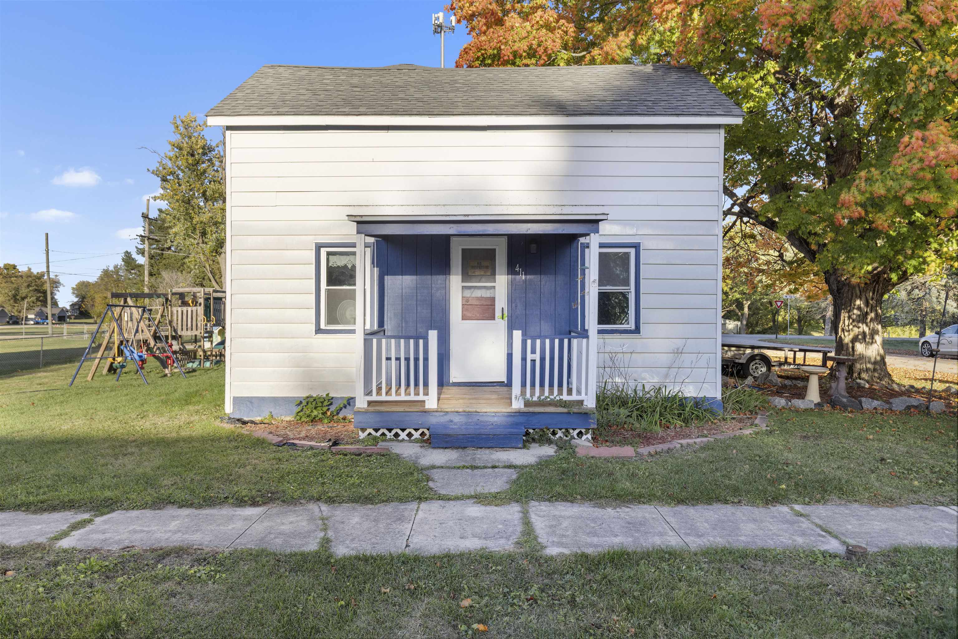 a front view of a house with garden