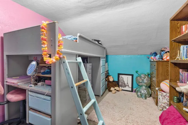 a room with furniture and a flat screen tv