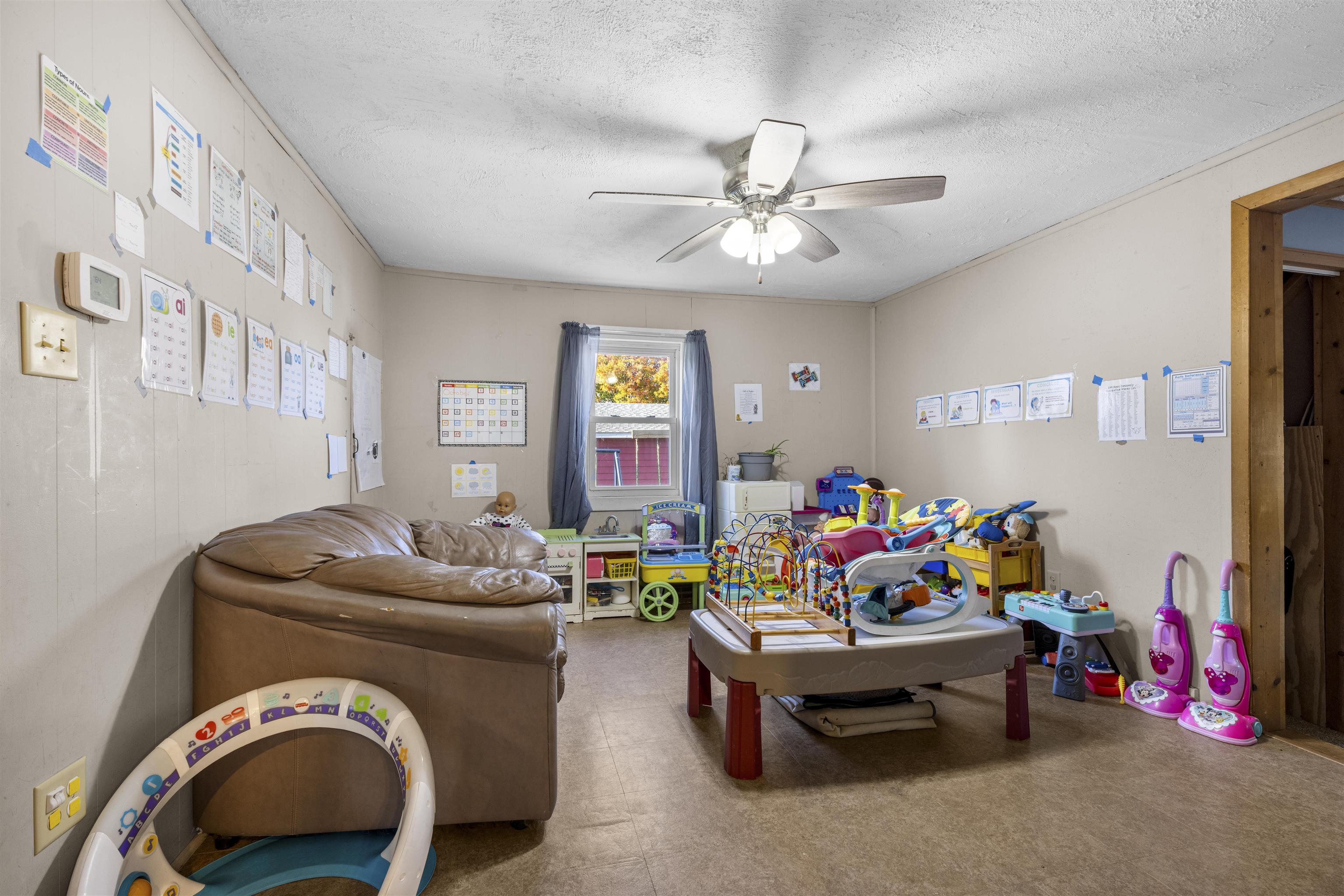 411 South Walnut Avenue Forreston, IL 61030 - Photo 17 of 19 a living room with furniture and a couch
