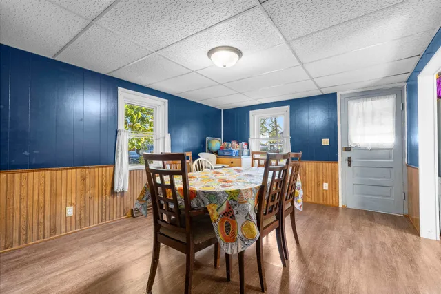 a view of a dining room with furniture and window