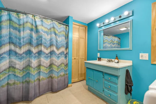 a bathroom with a sink a vanity and a mirror