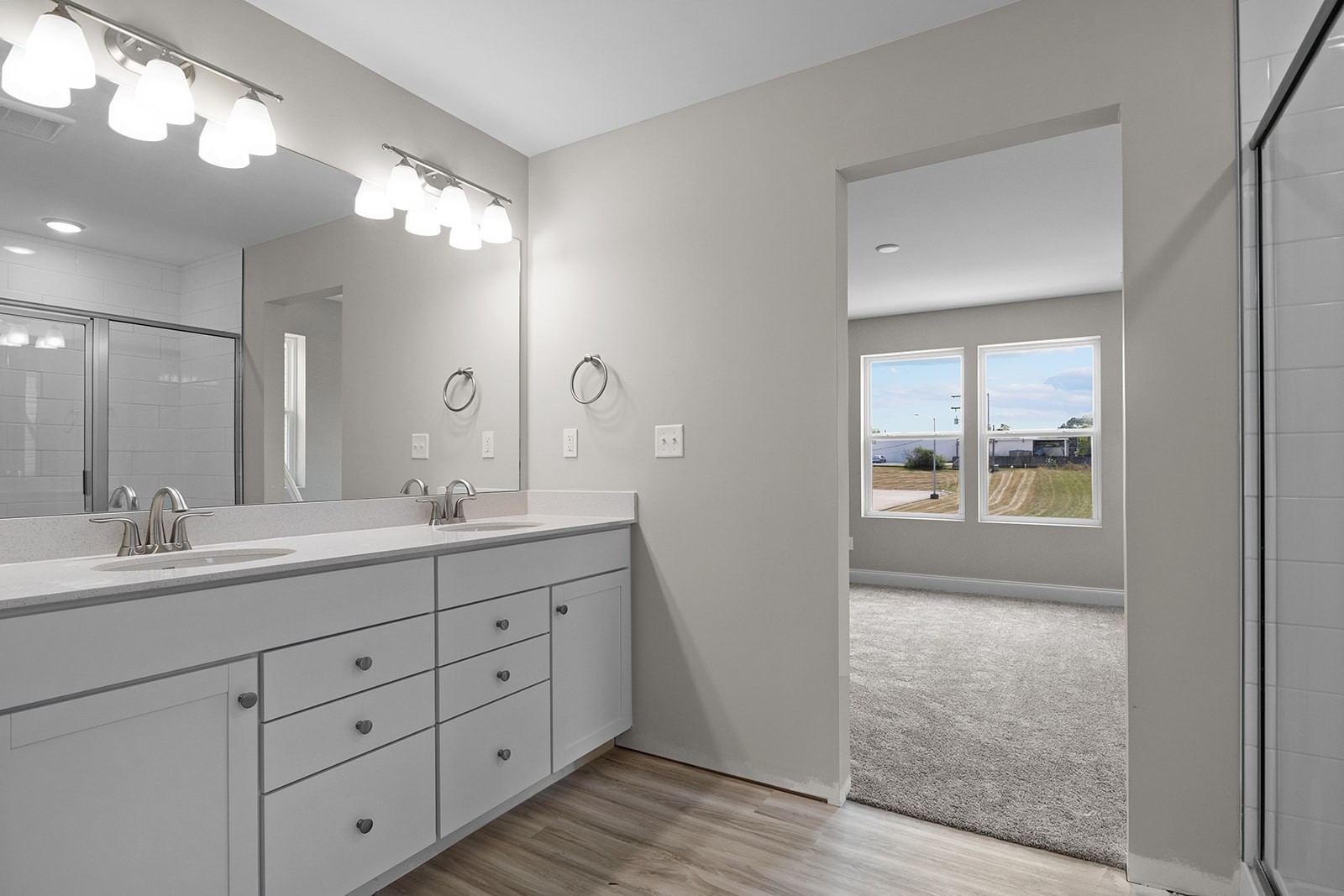 127 Timber Crest Trail White Bluff, TN 37187 - Photo 17 of 22 a bathroom with a double vanity sink and mirror with shower